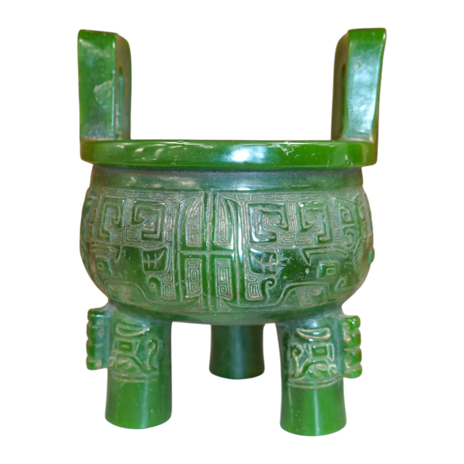 A Chinese green glass tripod censer, 20cm high. Condition - fair